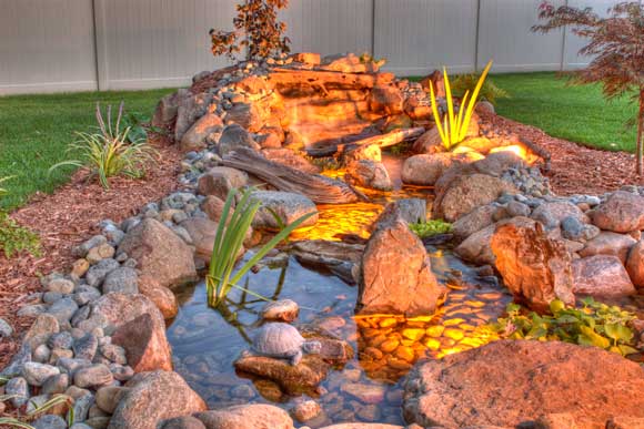 Pondless water feature with a low voltage lighting system