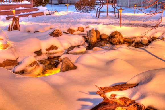 Pondless water feature after a snowstorm